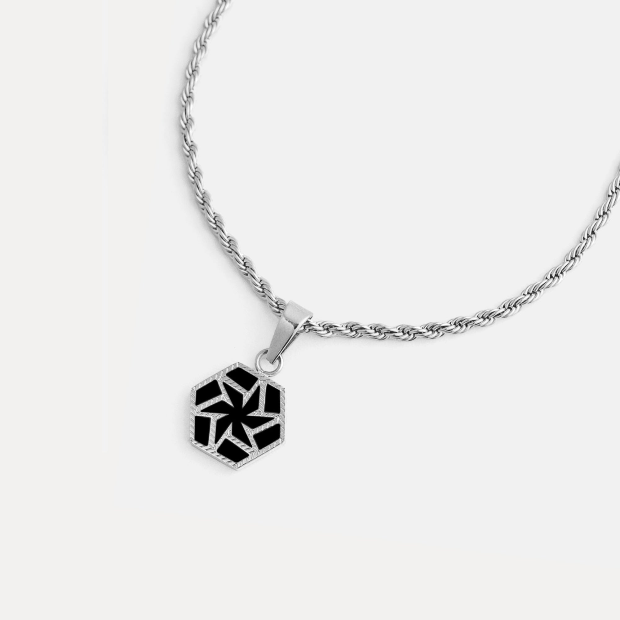 Necklace with a geometric pendant on a white background