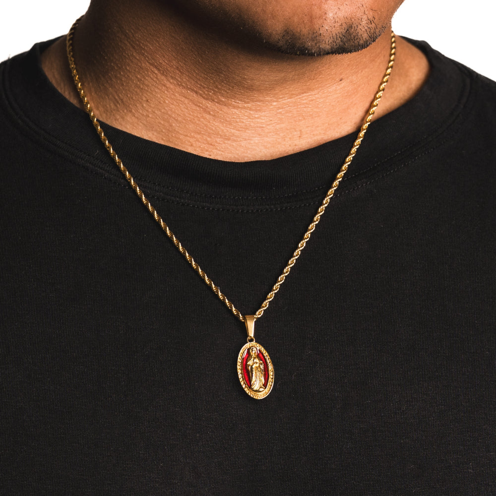 Gold necklace with a pendant on a black shirt