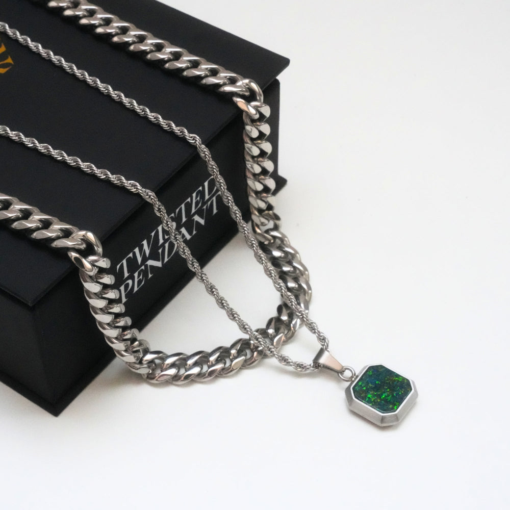 Silver chain necklace with a pendant on a branded box
