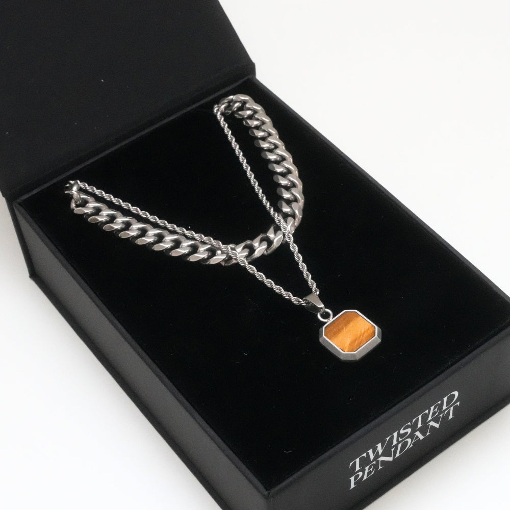 Silver chain necklace with a pendant in a black box labeled 'Twisted Pendant'.