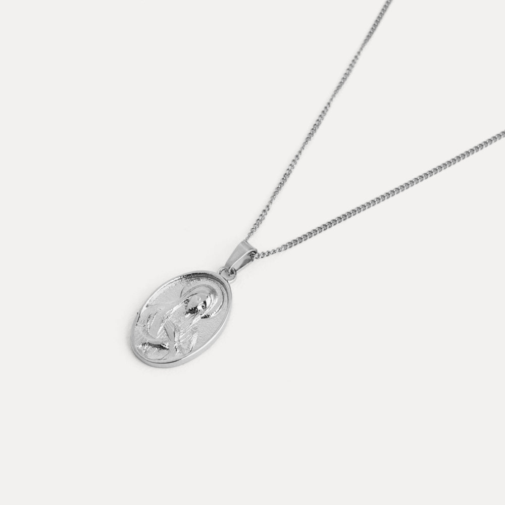 Silver necklace with a pendant on a white background