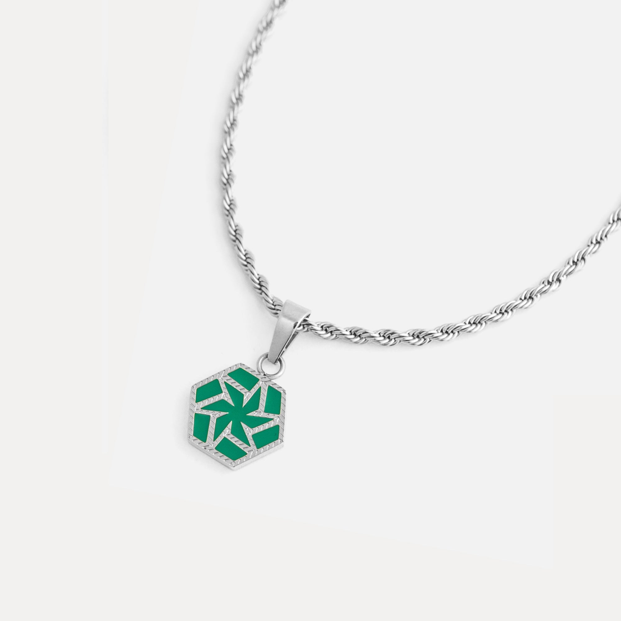 Necklace with a green geometric pendant on a white background