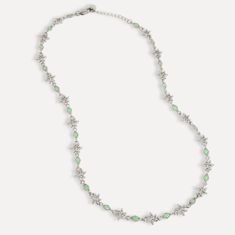 Necklace with green gemstones and silver chain on a white background