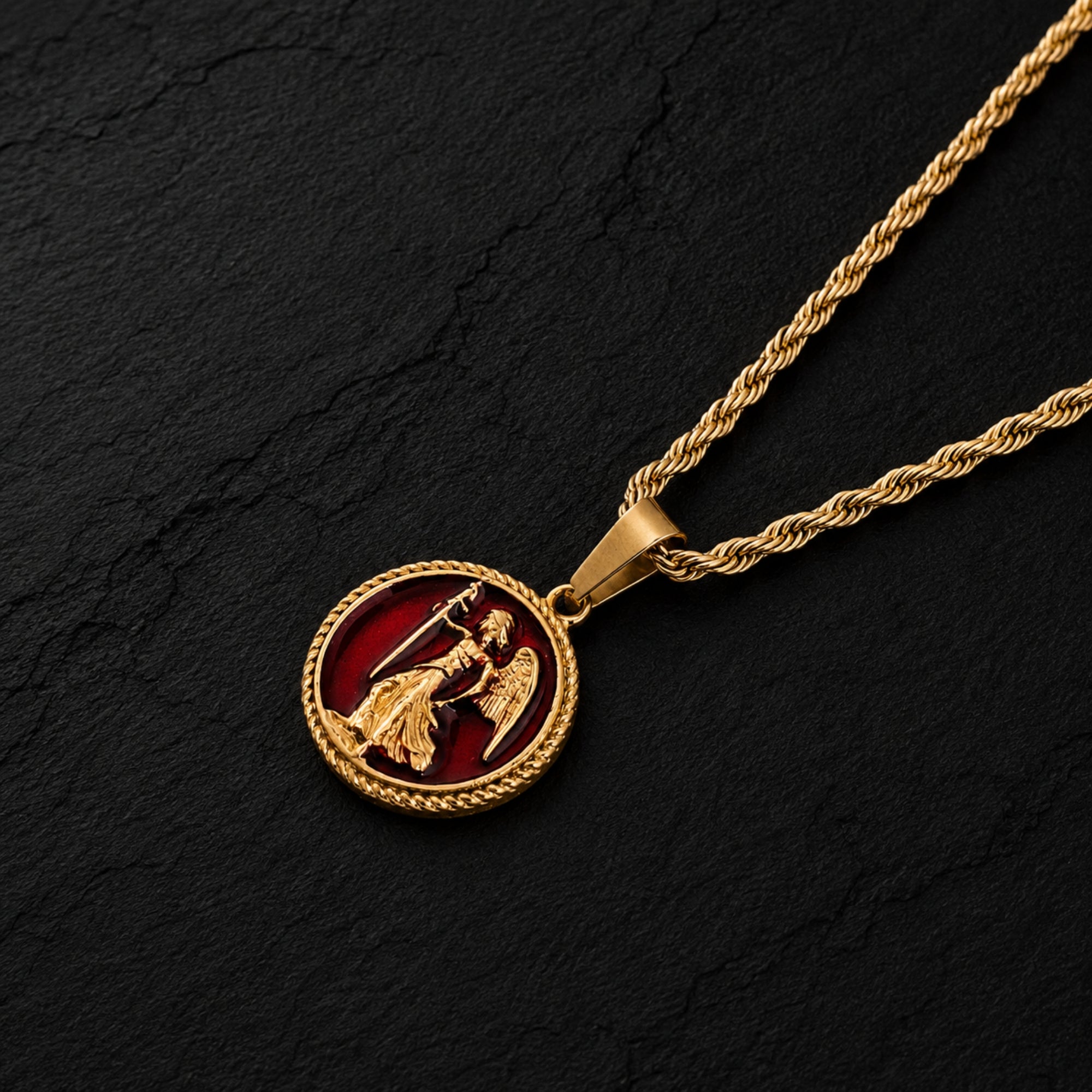 Gold necklace with a circular pendant featuring an angel on a dark background