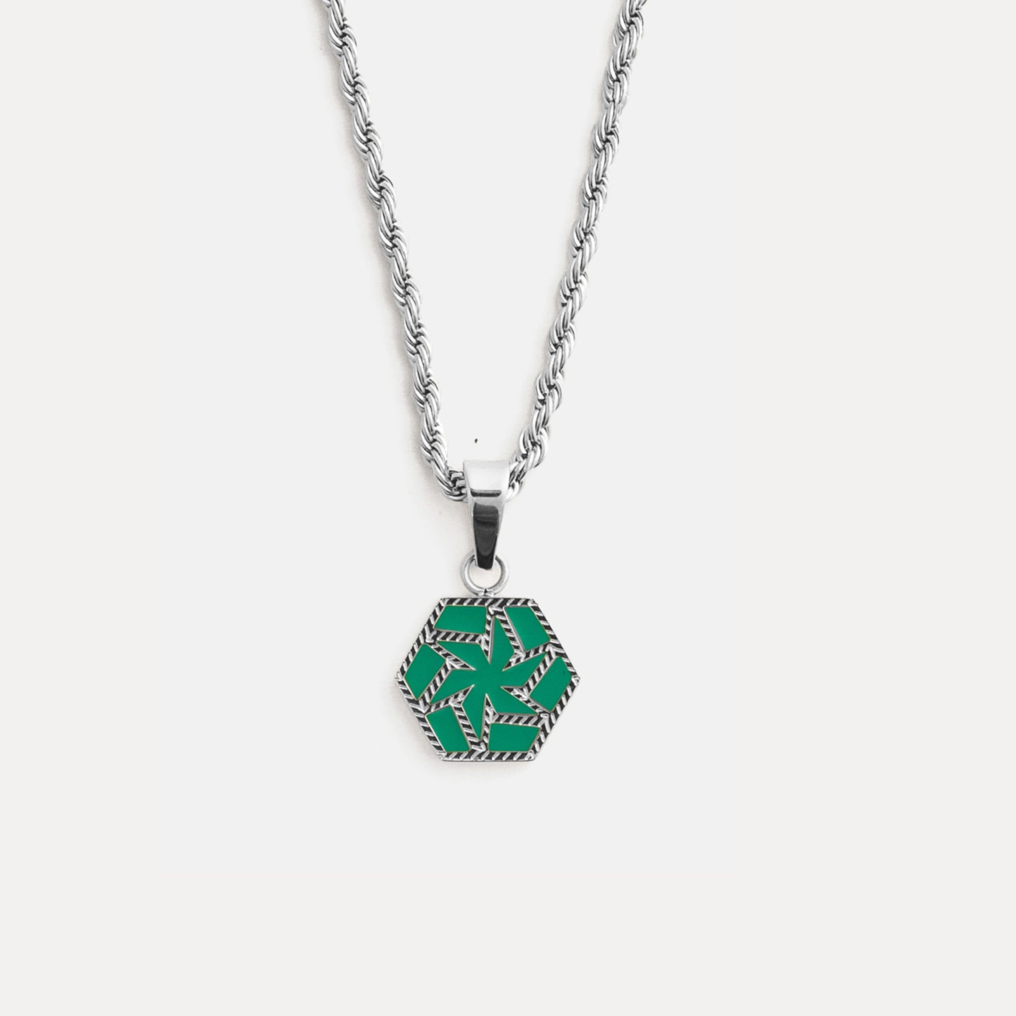 Necklace with a green pendant on a white background