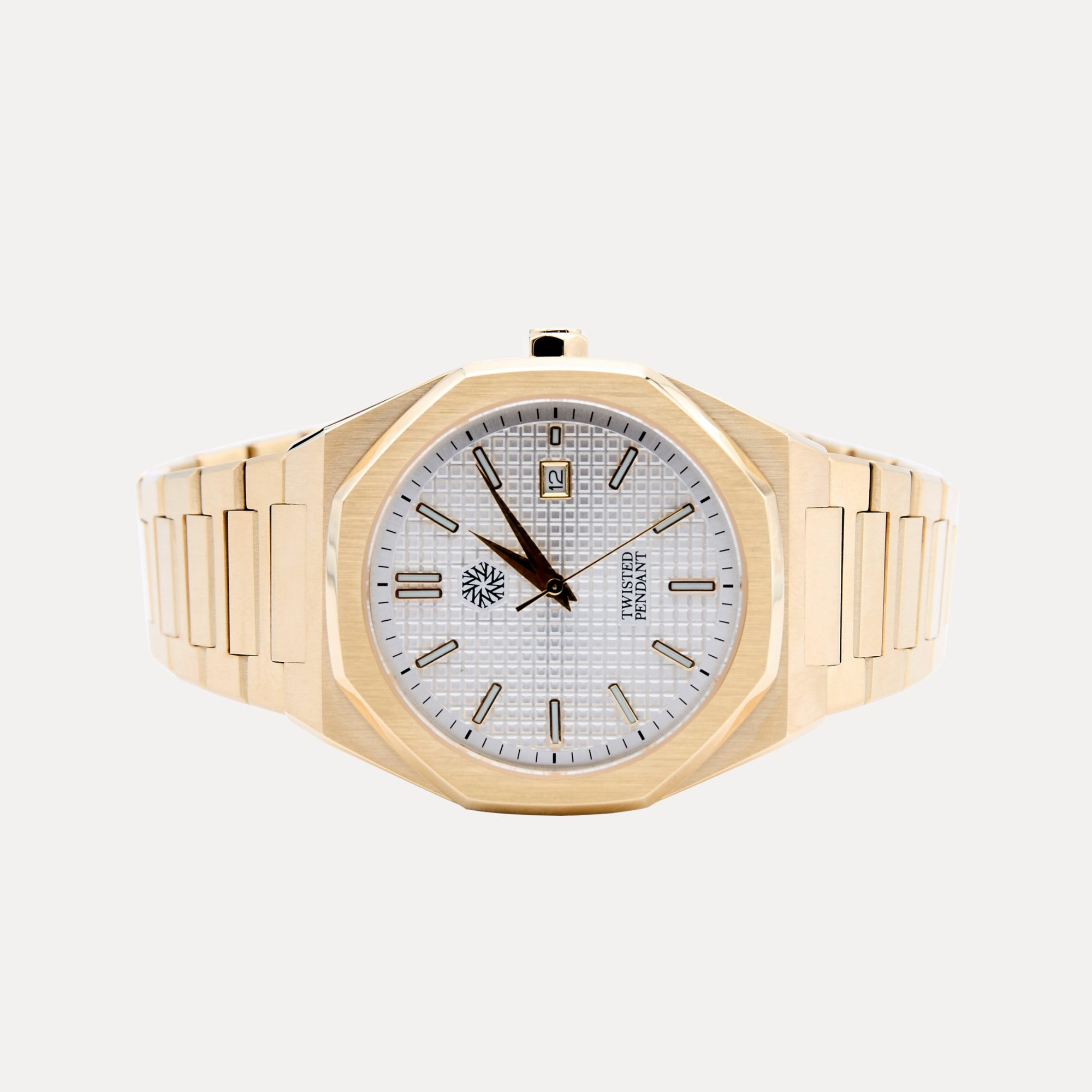 Gold wristwatch with a white face on a light gray background