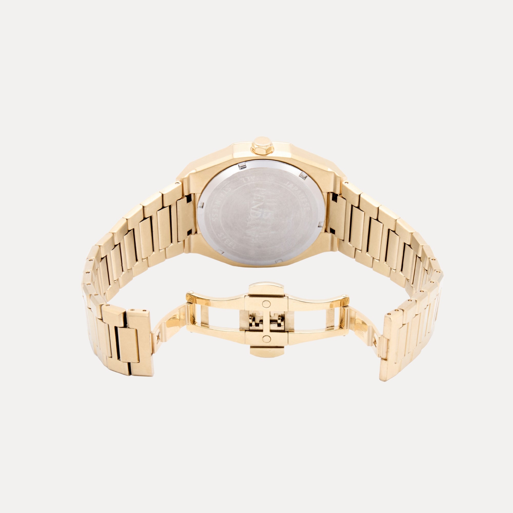 Gold watch with a white face on a light gray background