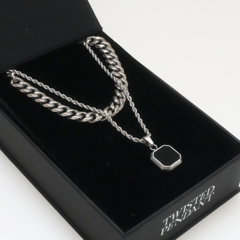 Silver twisted pendant necklace on a black box with 'Twisted Pendant' text.