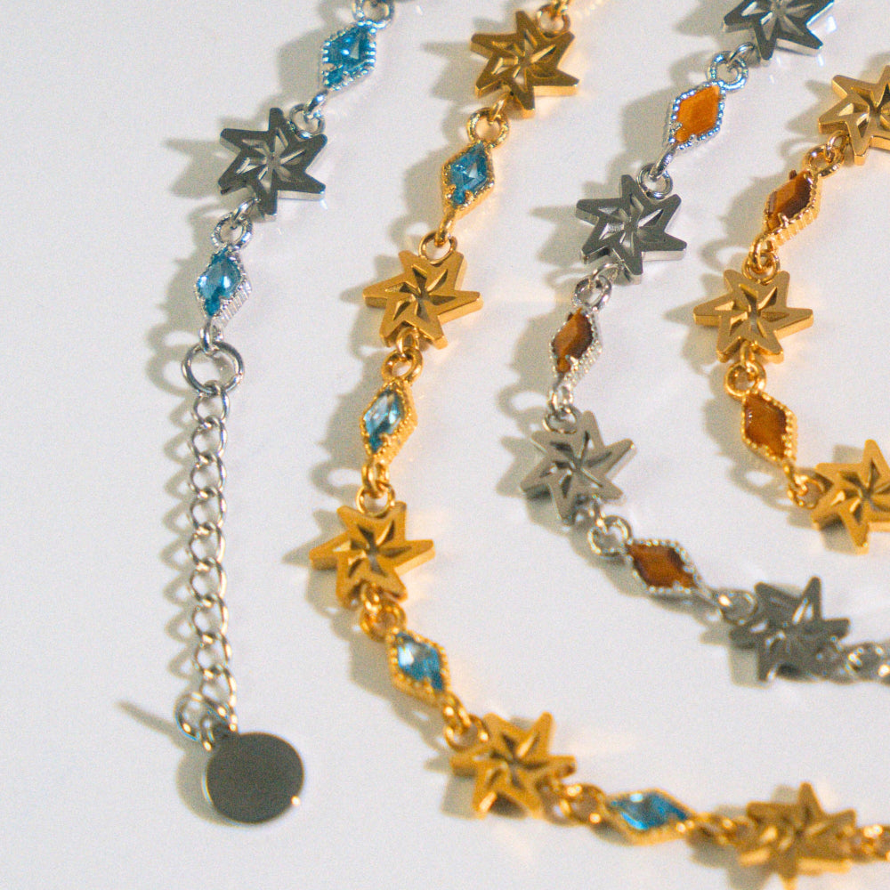 Necklace with star-shaped charms on a white background