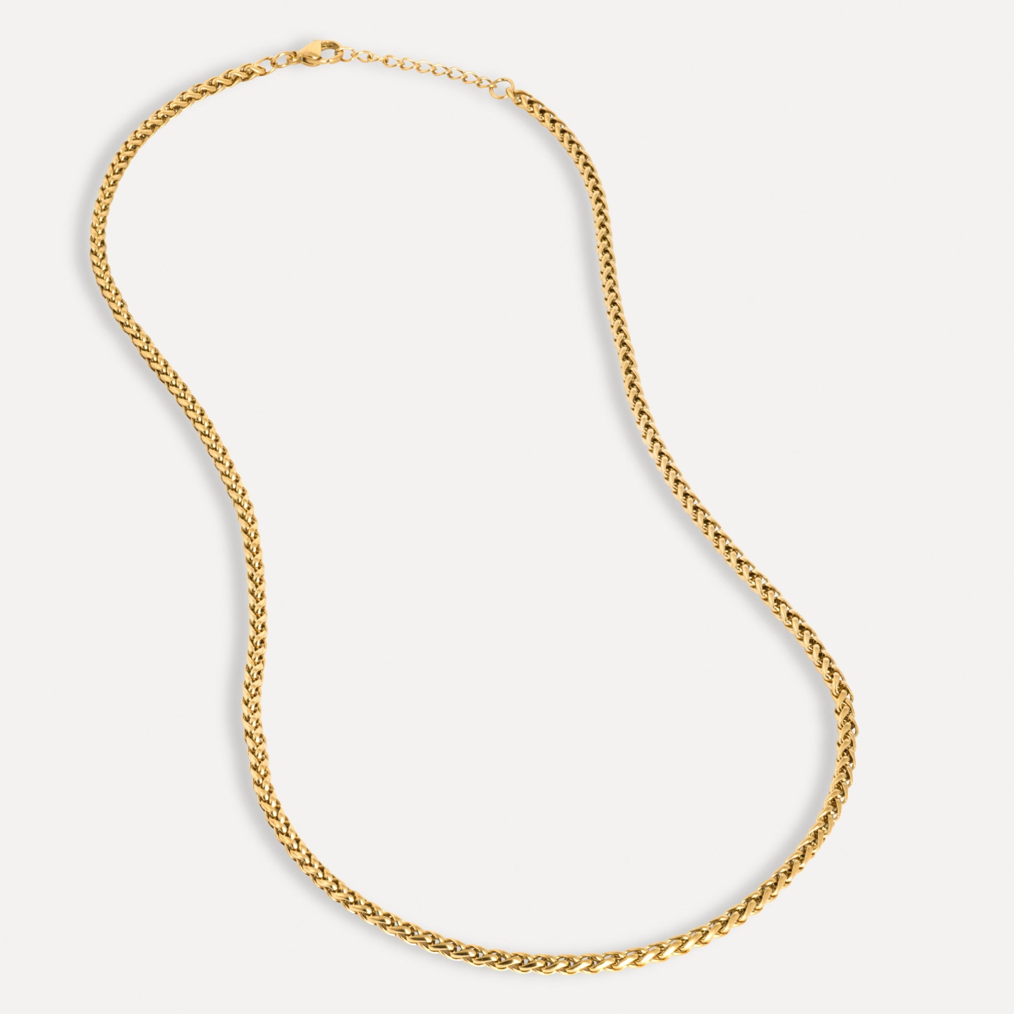 Gold chain necklace on a white background