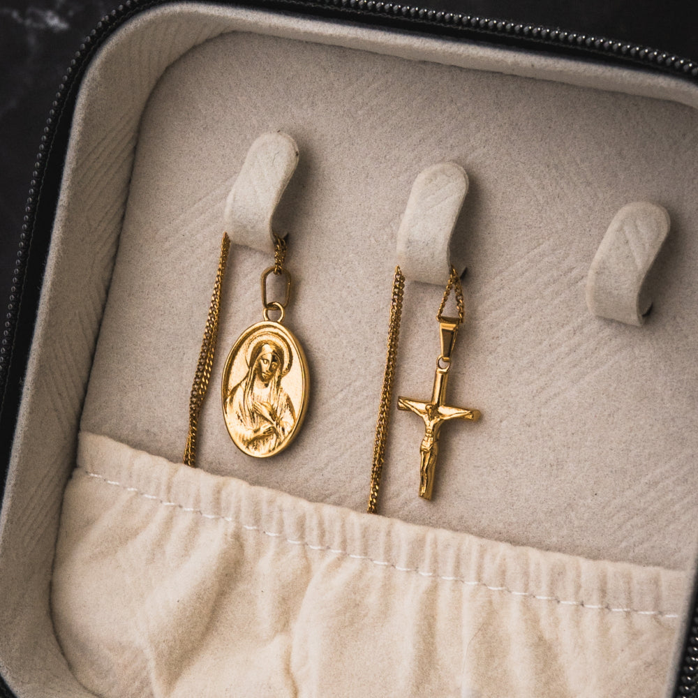 Gold religious pendants in a jewelry box
