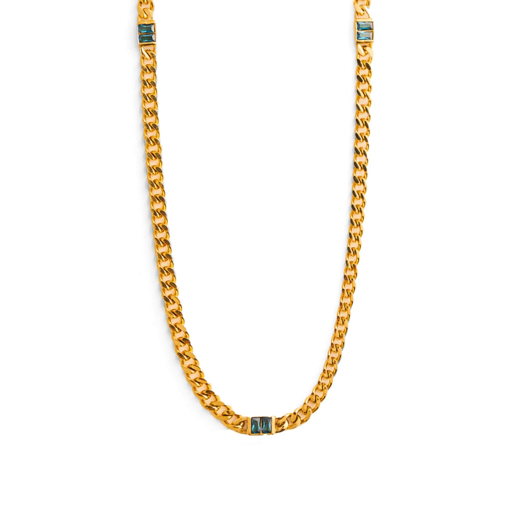 Gold chain necklace with blue accents on a white background