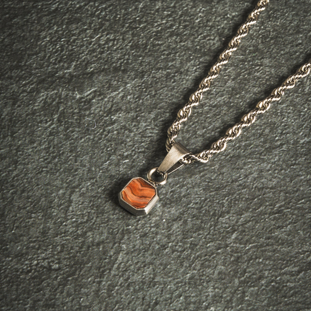 Necklace with a pendant on a dark gray background