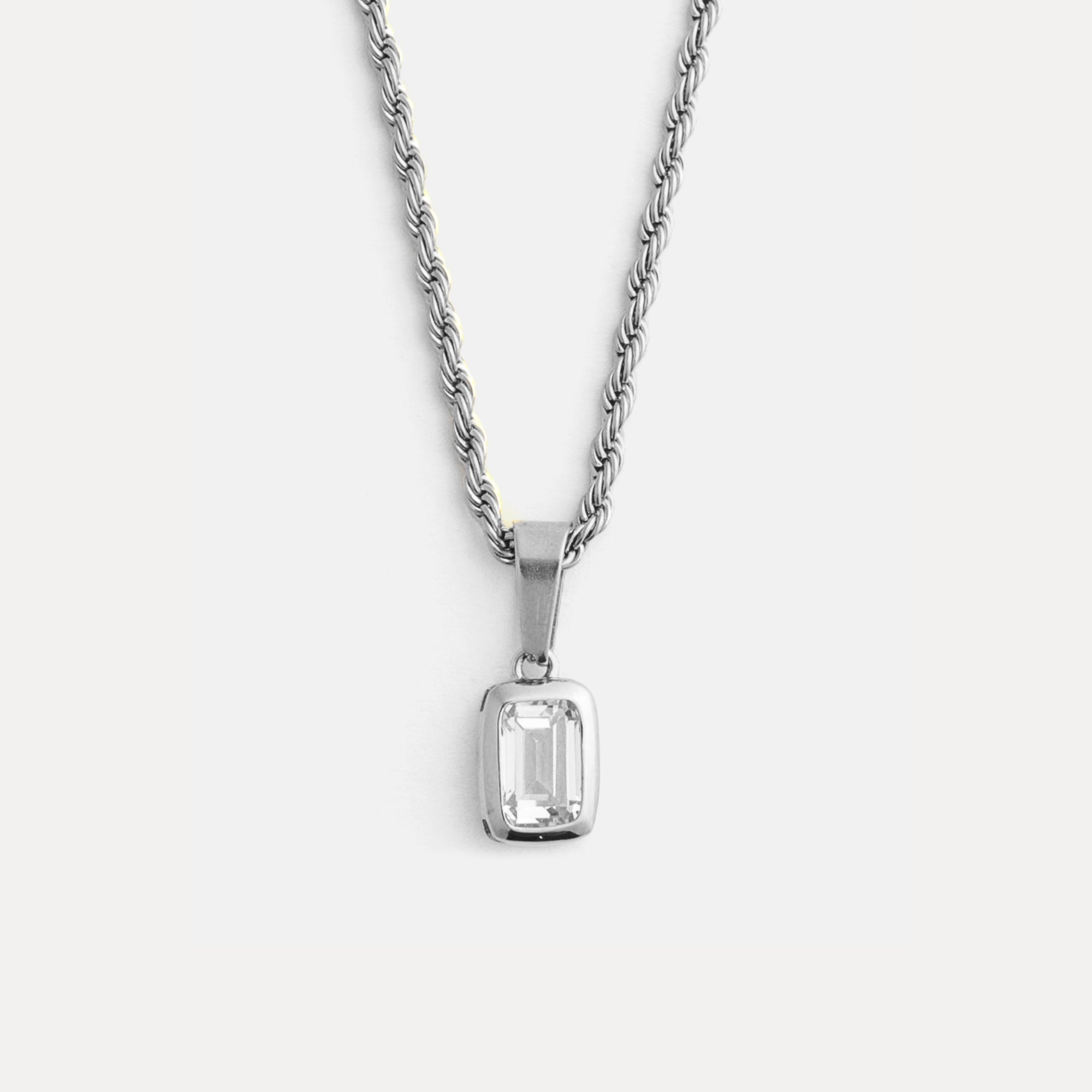 Silver pendant necklace on a white background