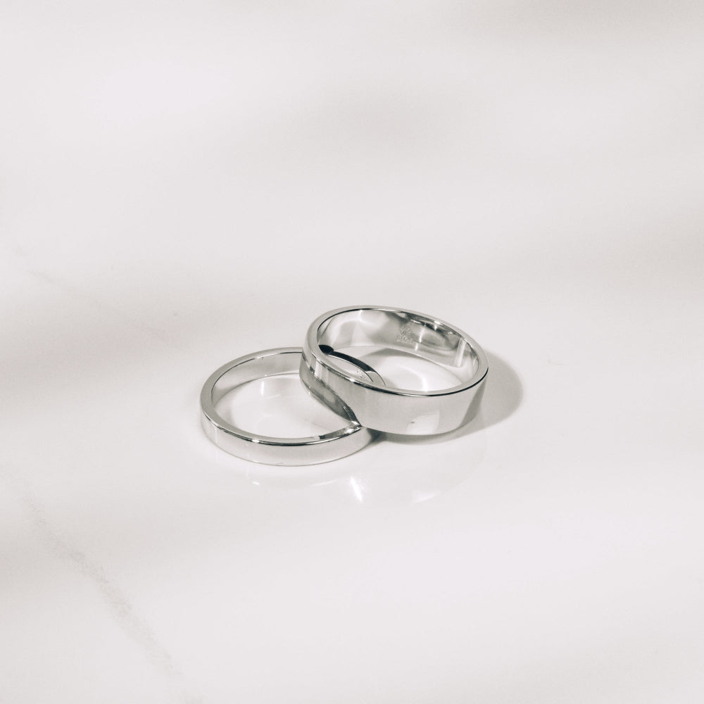 Two silver rings on a white background