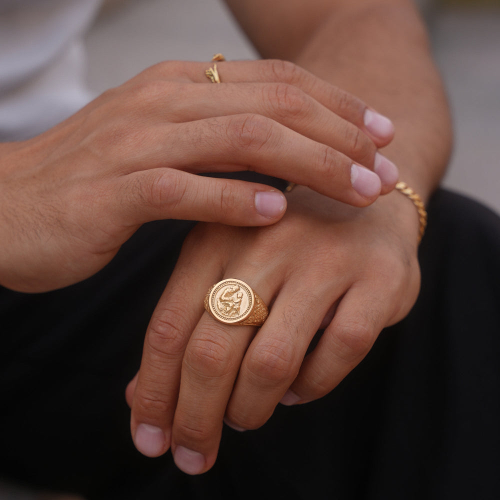 Close-up of hands with gold rings on fingers