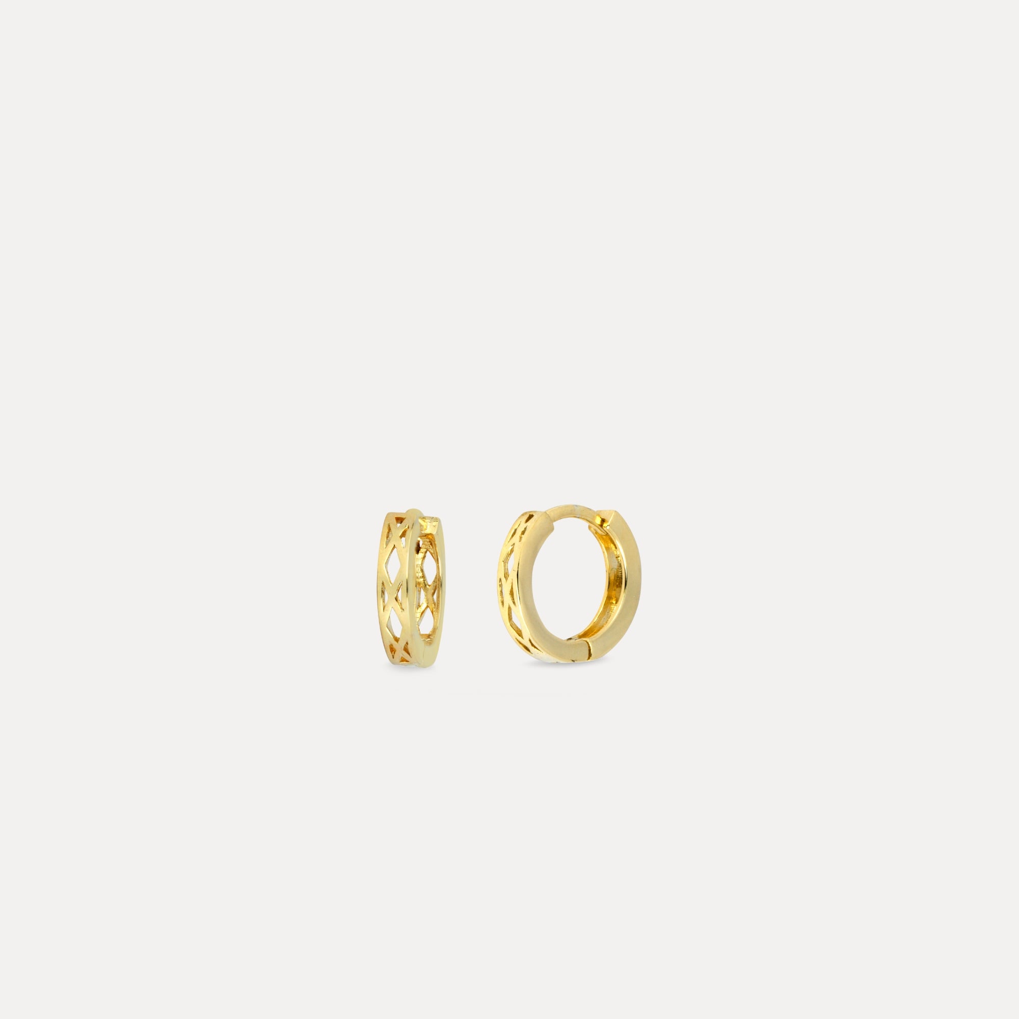 Gold hoop earrings on a white background