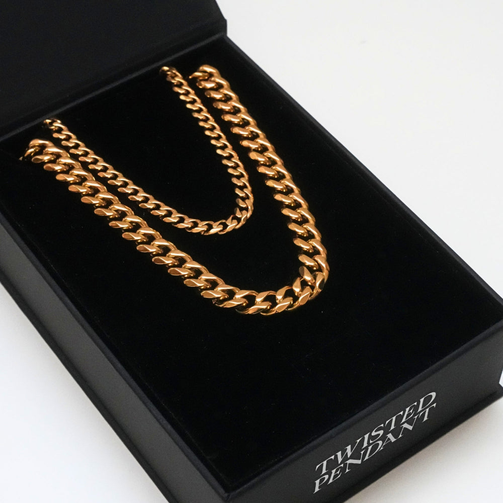 Gold chain necklace in a black box with 'Twisted Pendant' branding.