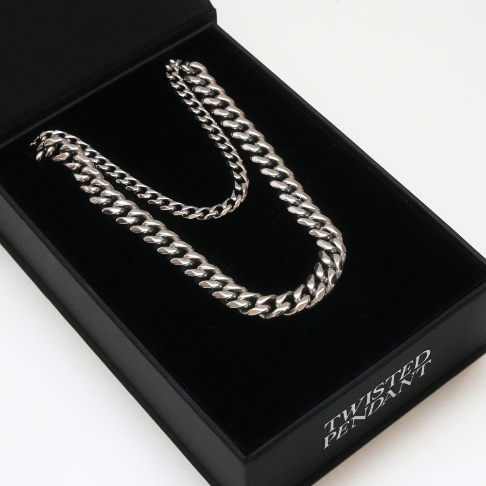 Silver twisted chain necklace in a black box labeled 'Twisted Pendant'.
