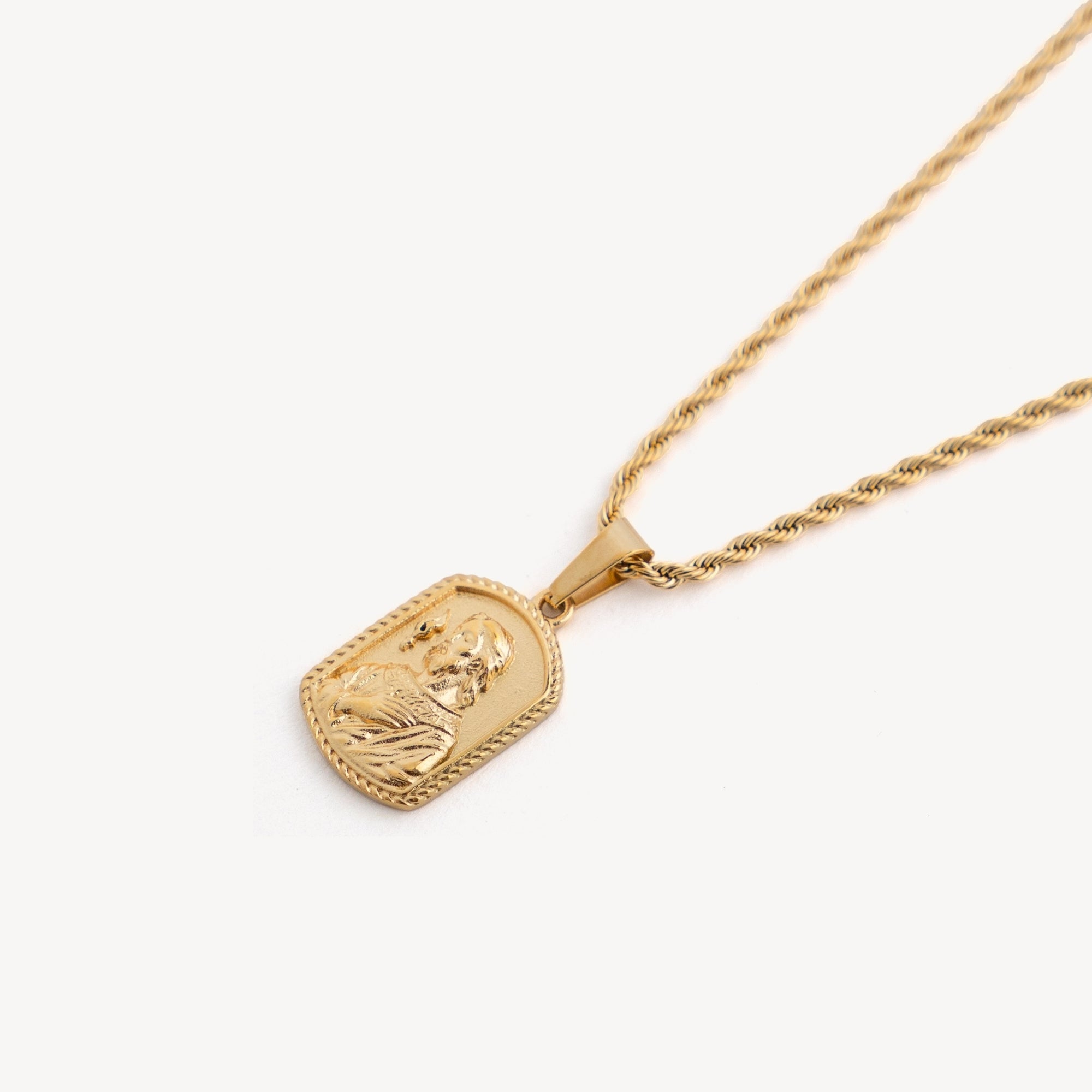 Gold necklace with a pendant on a white background