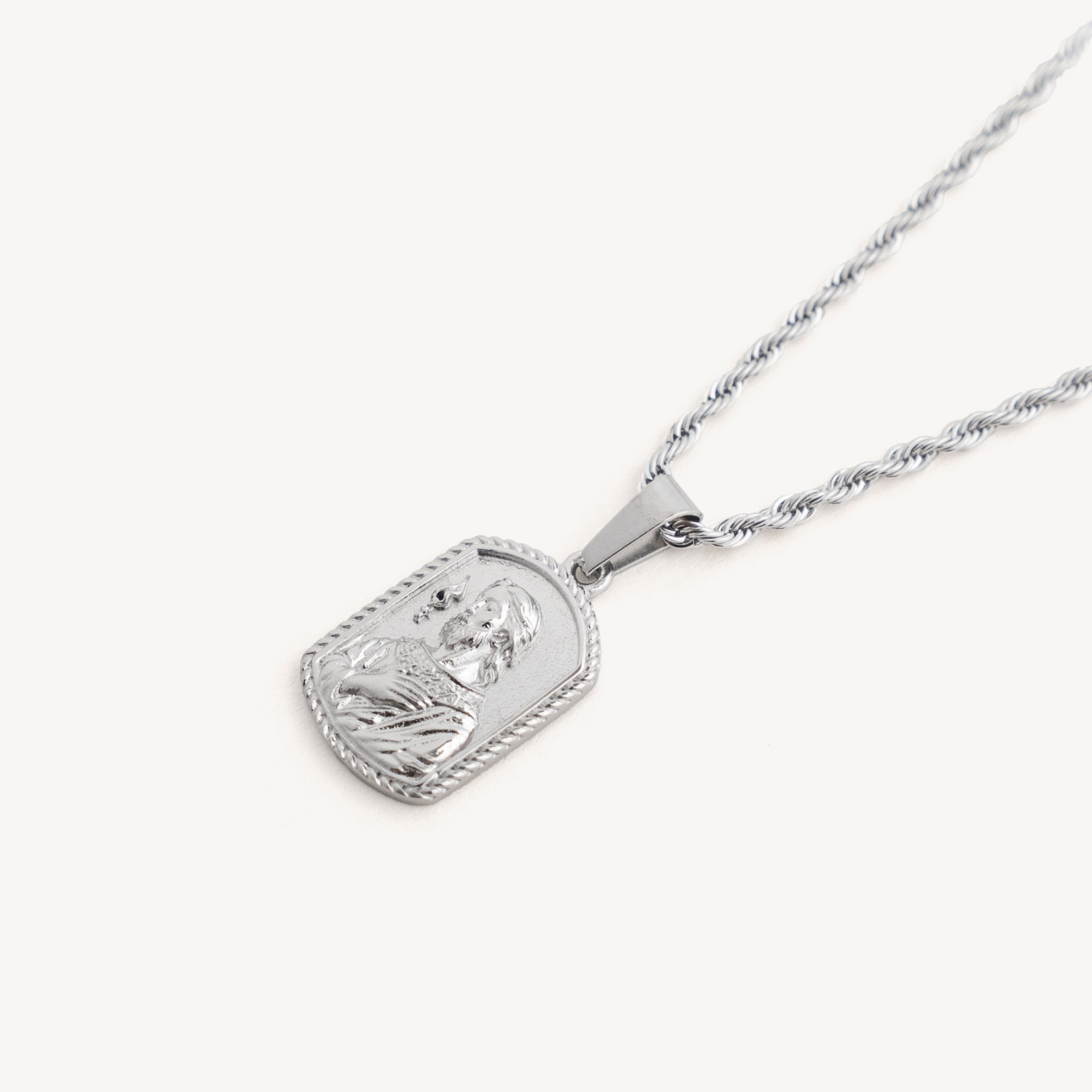 Silver pendant necklace on a white background