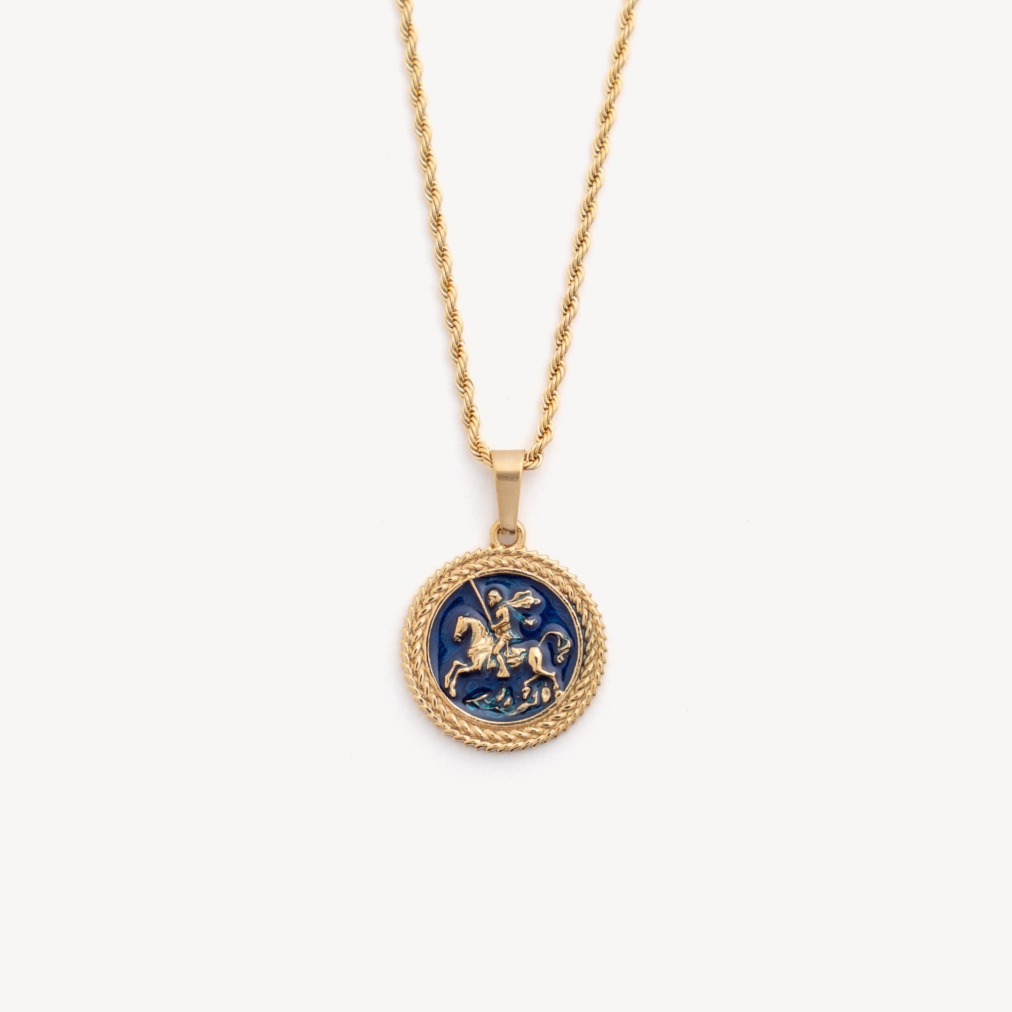 Gold necklace with a blue pendant on a white background