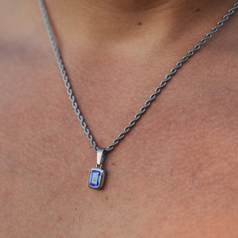 Necklace with a pendant on a person's neck