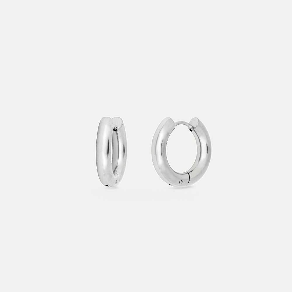 Pair of silver hoop earrings on a white background
