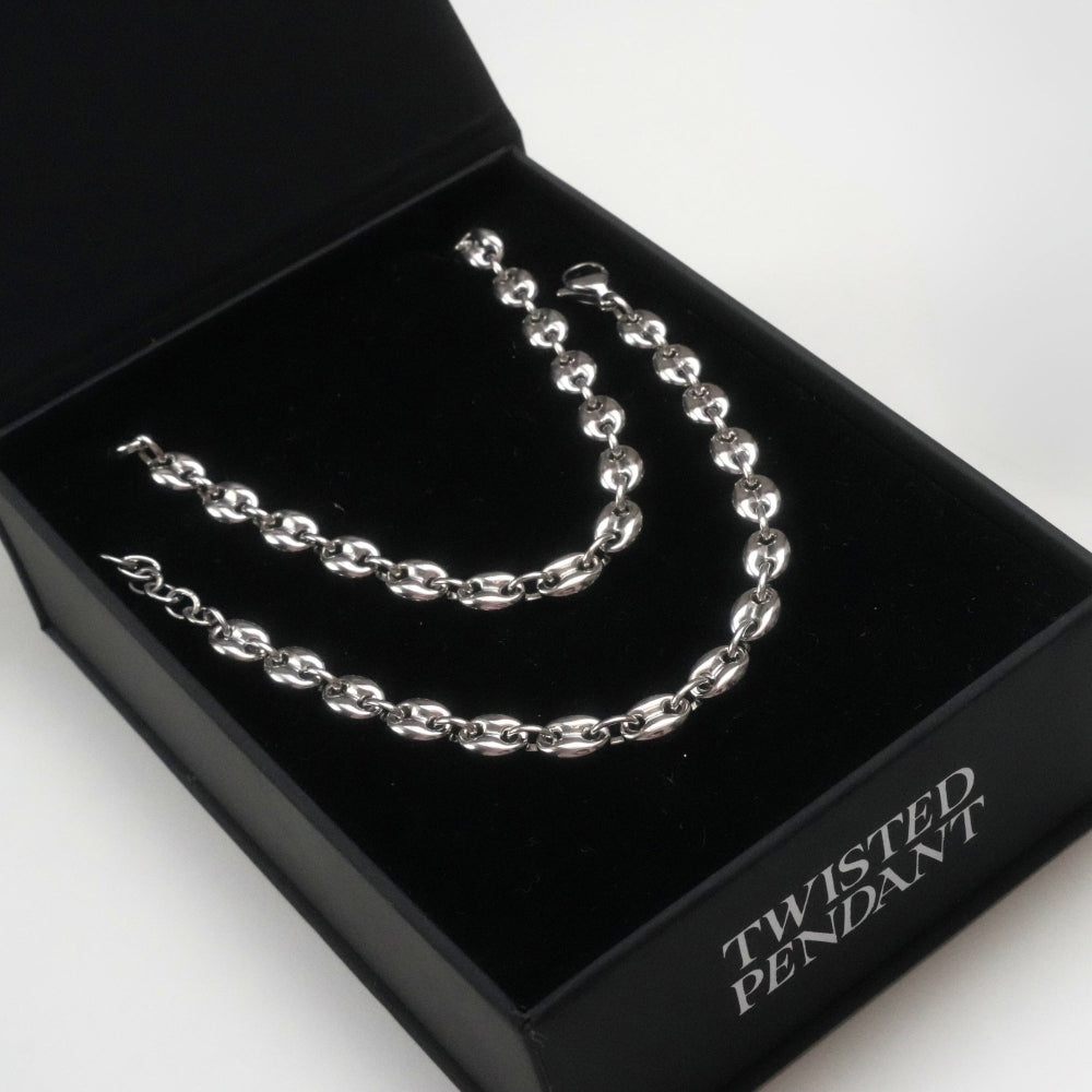 Silver chain necklace in a black jewelry box with 'Twisted Pendant' text.