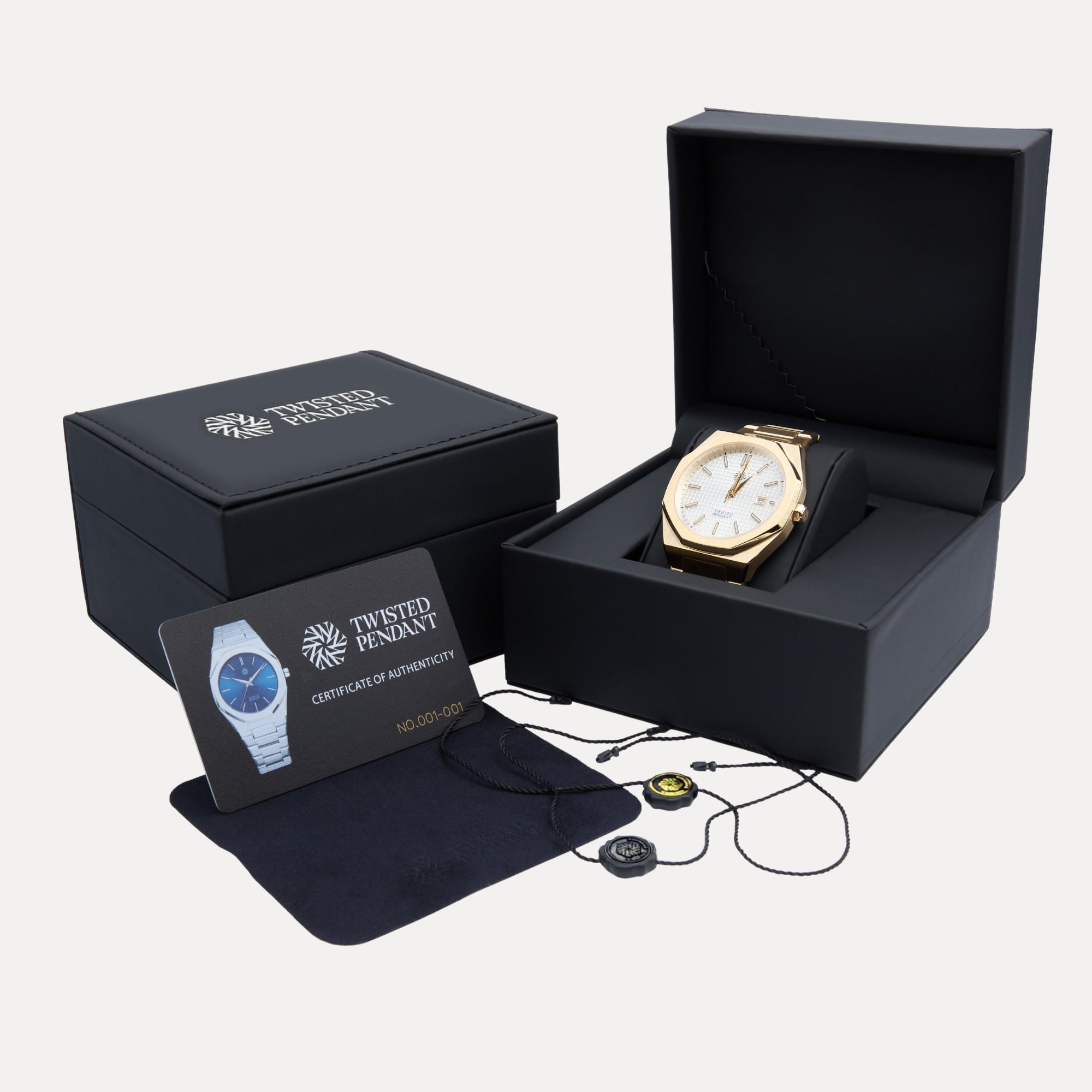Gold watch in a black box with a certificate of authenticity on a white background