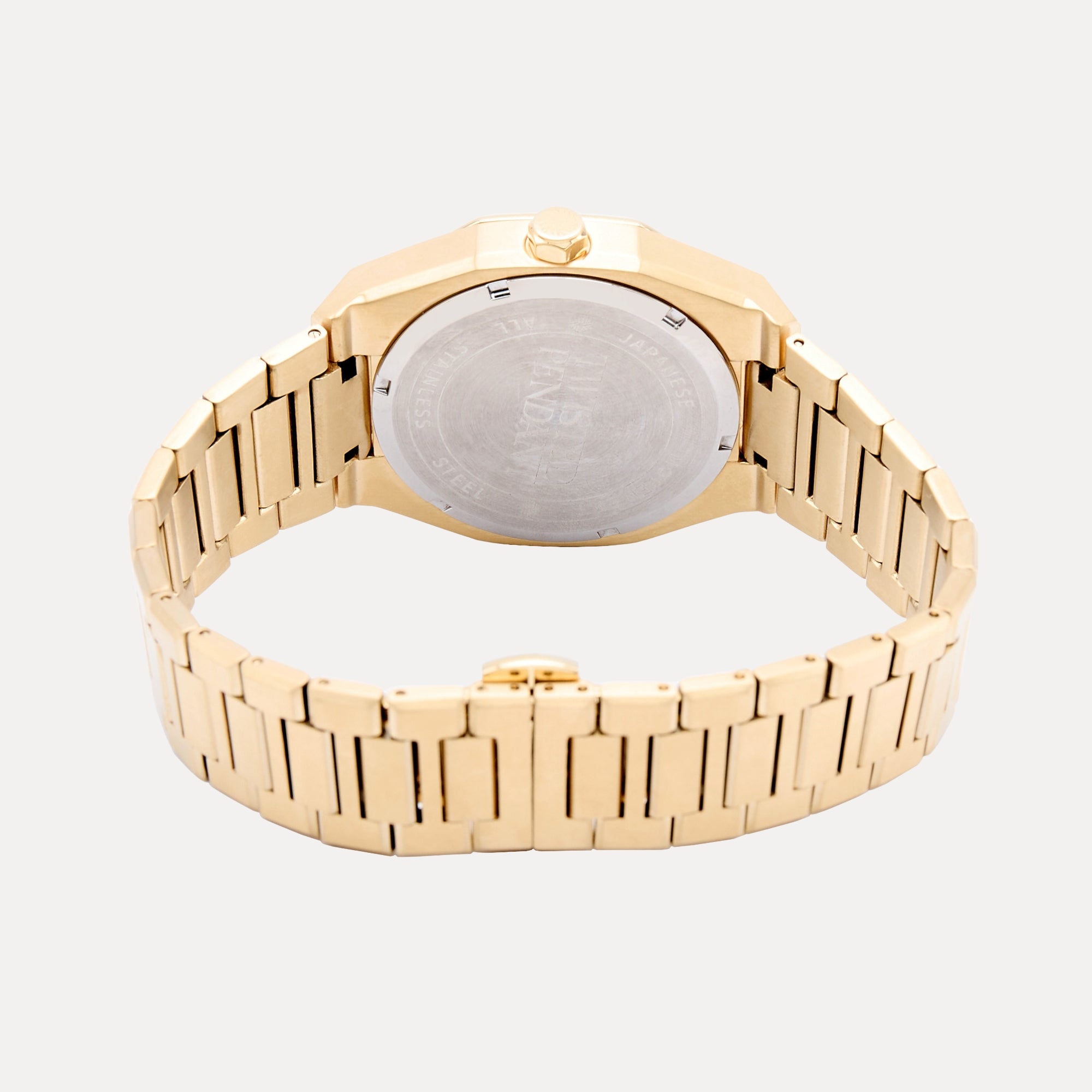 Gold watch with a visible brand logo on a light gray background