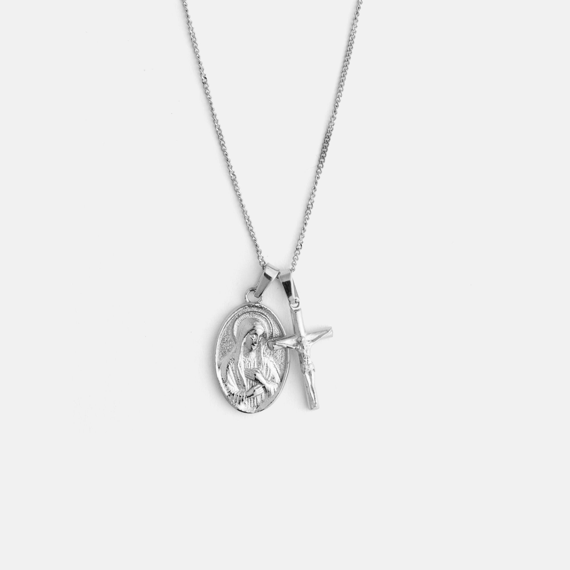 Silver necklace with a pendant on a light gray background