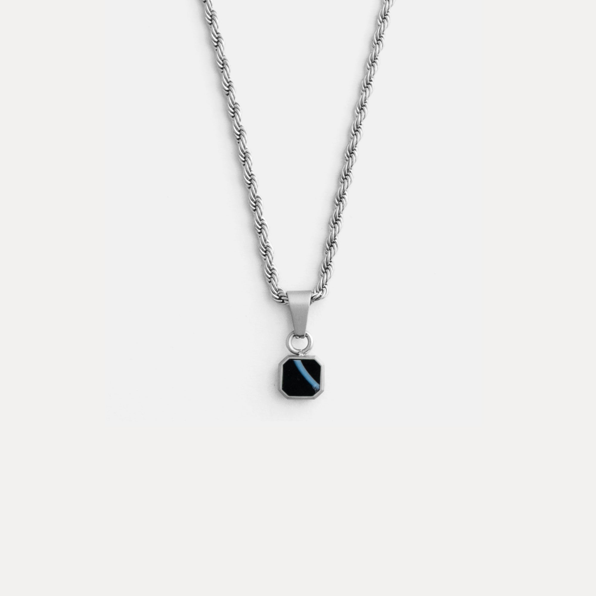Necklace with a black pendant on a white background