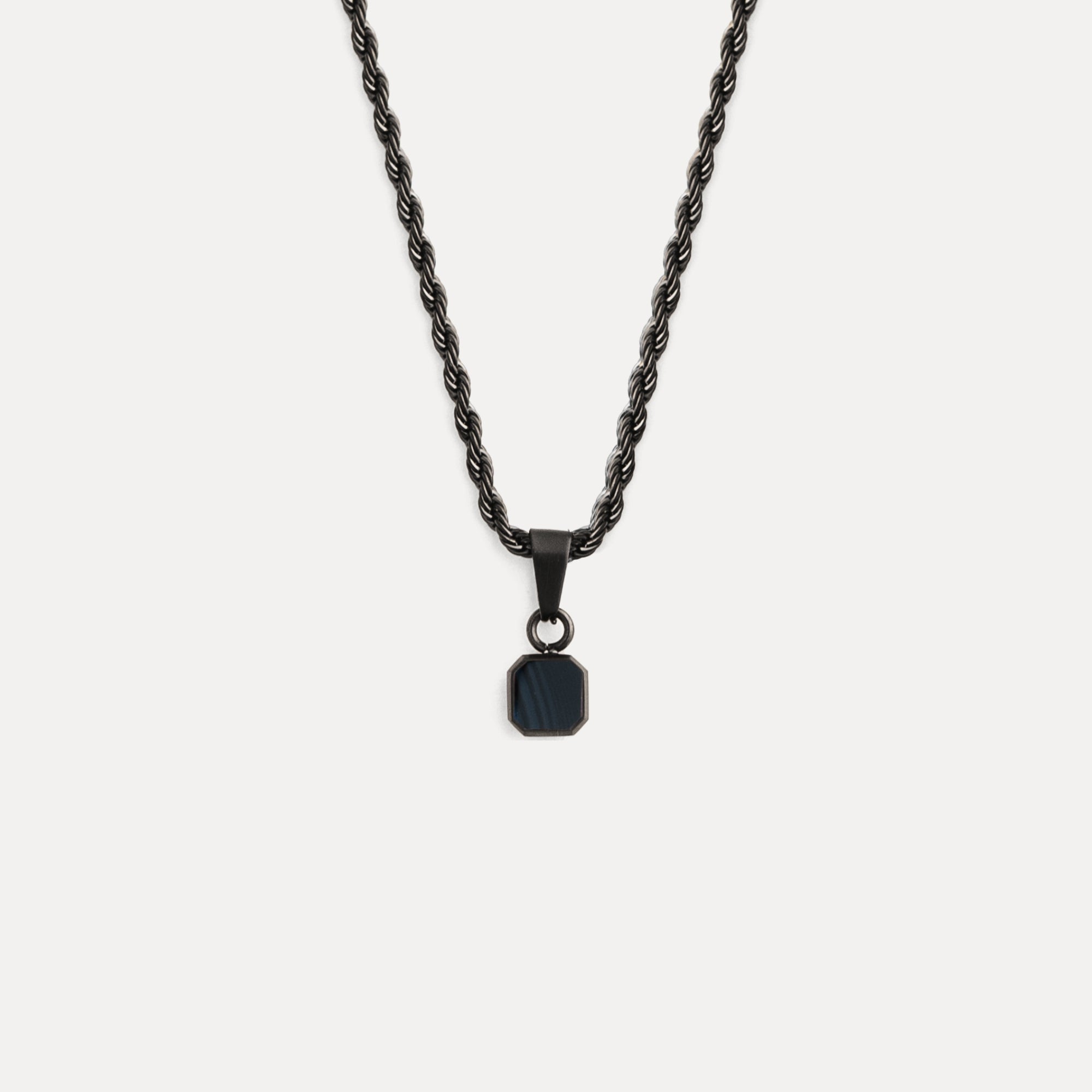 Black necklace with a pendant on a white background