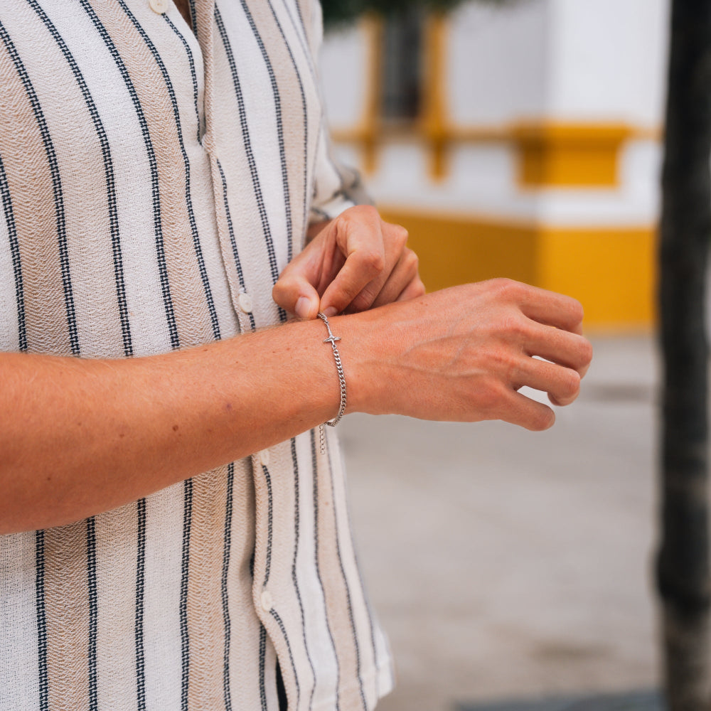 Person wearing a striped shirt with a blurred background