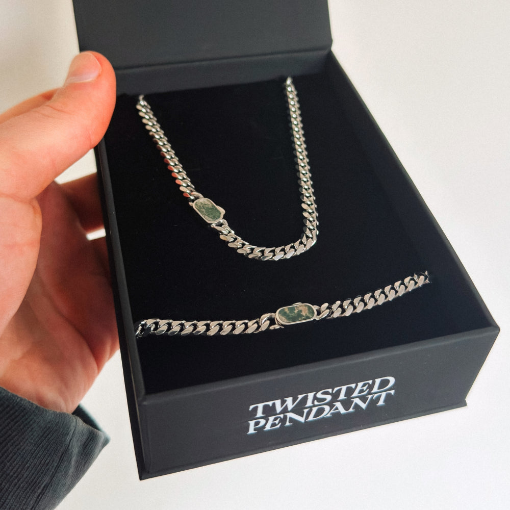 Silver chain necklace with twisted pendant in a 'Twisted Pendant' box.