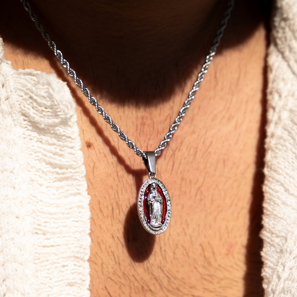 Necklace with a pendant featuring a religious figure on a textured beige background