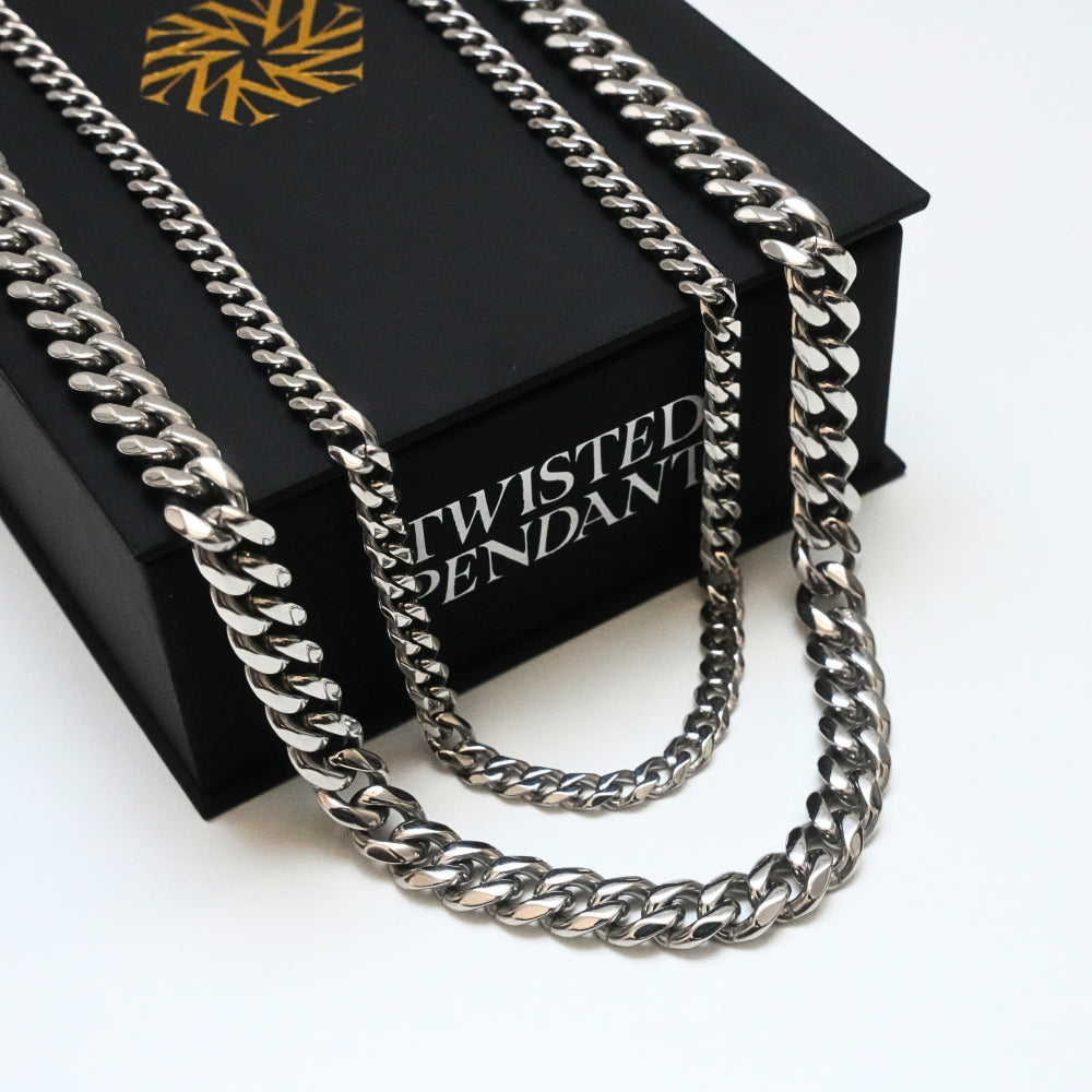 Silver chain necklace on a black box with 'Twisted Pendant' branding.