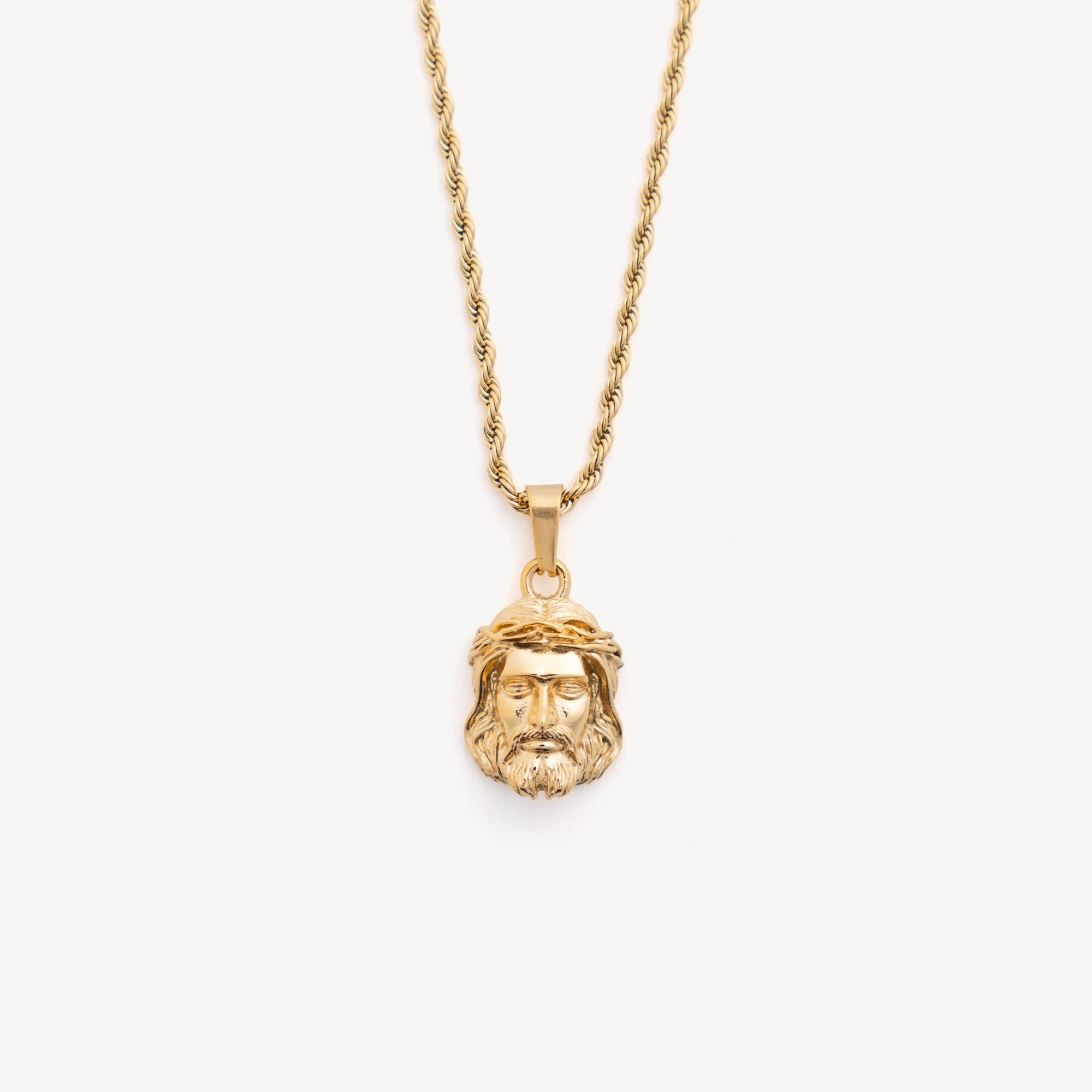 Gold necklace with a pendant on a white background