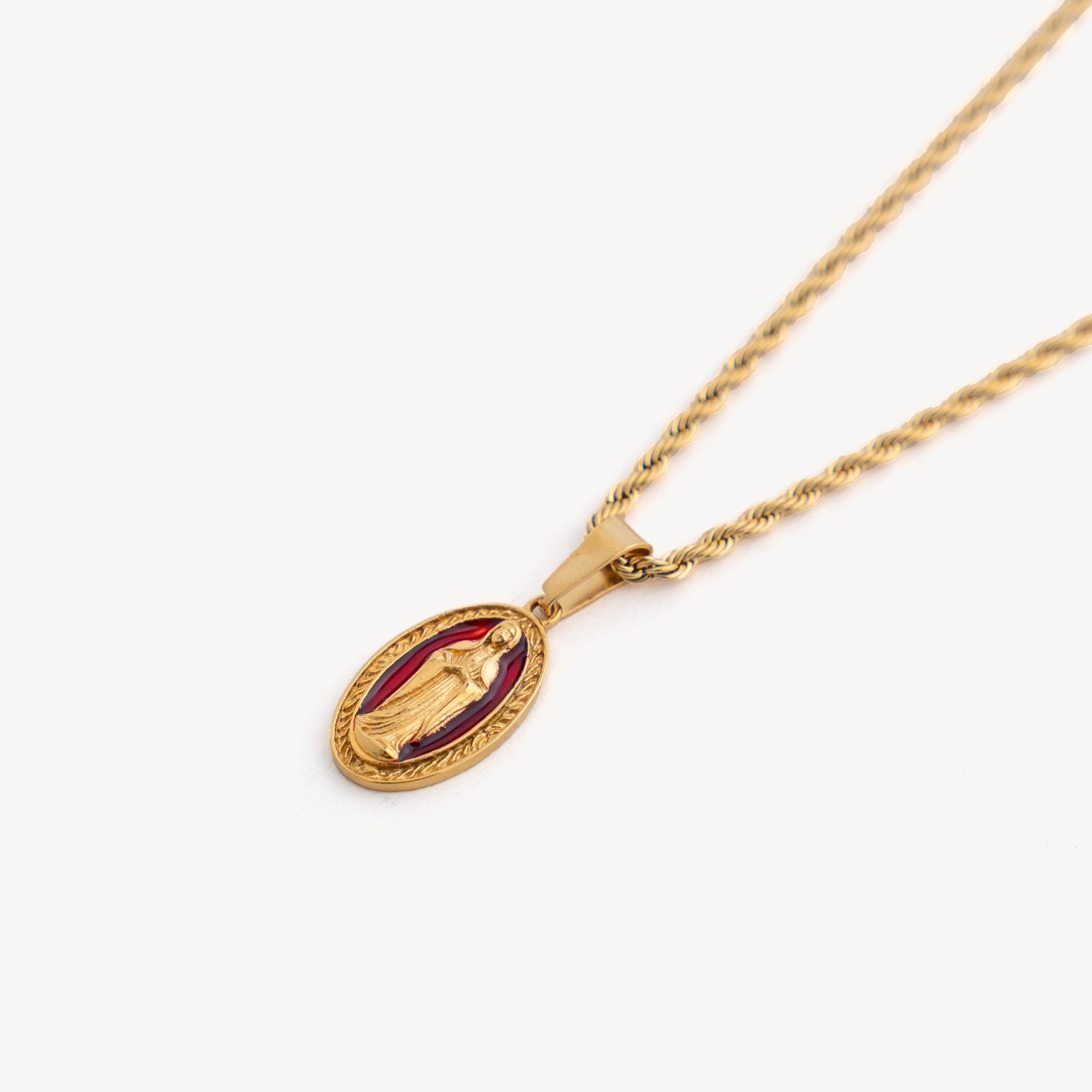Gold necklace with a pendant on a white background