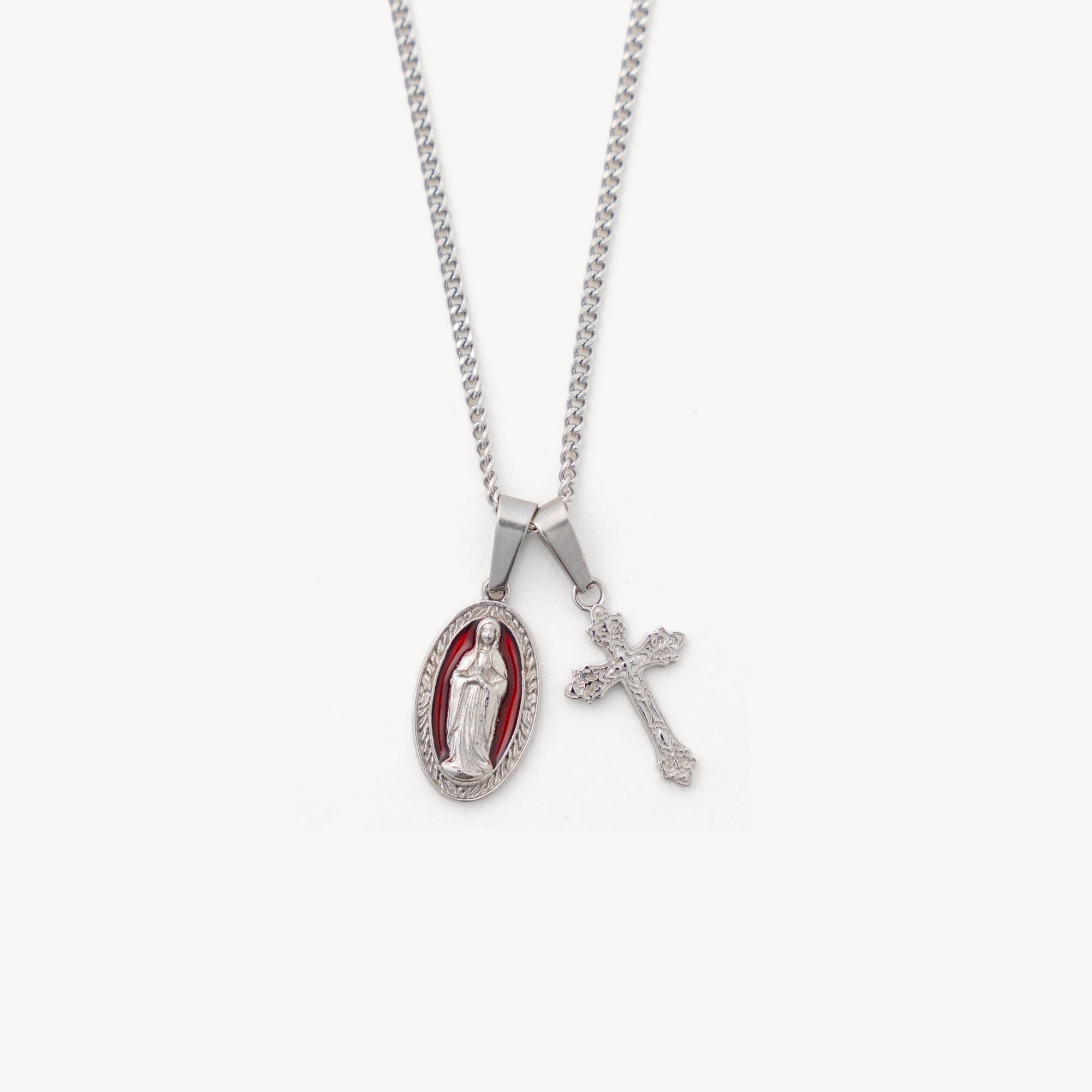 Necklace with a religious pendant and cross on a white background