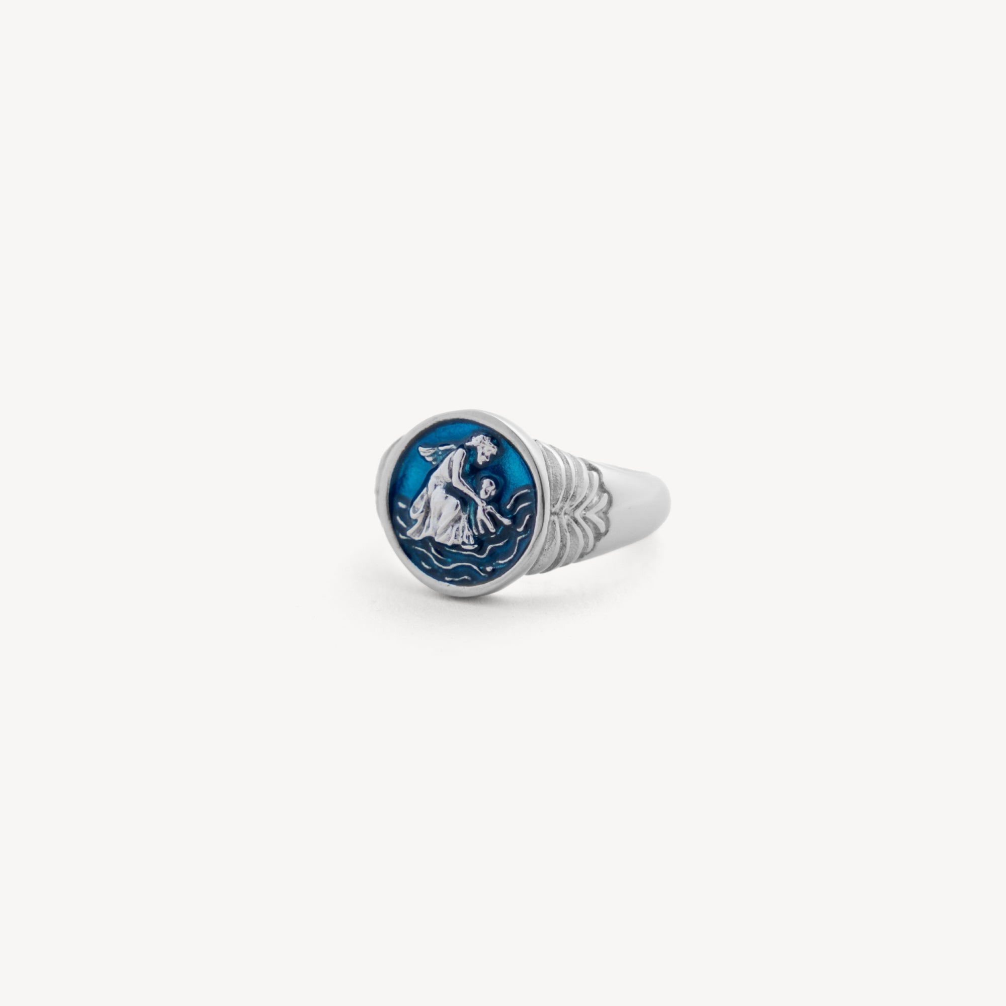 Silver ring with a modern design on a light gray background