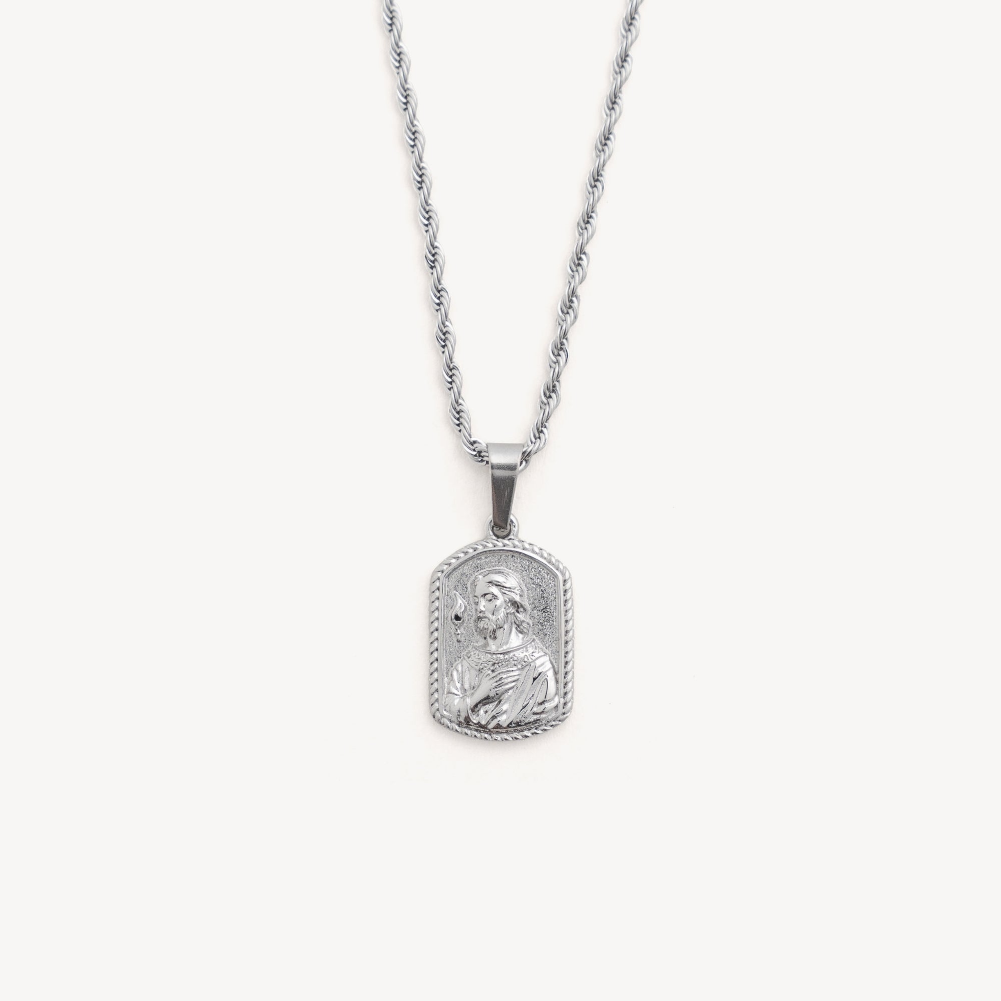 Silver pendant necklace on a white background