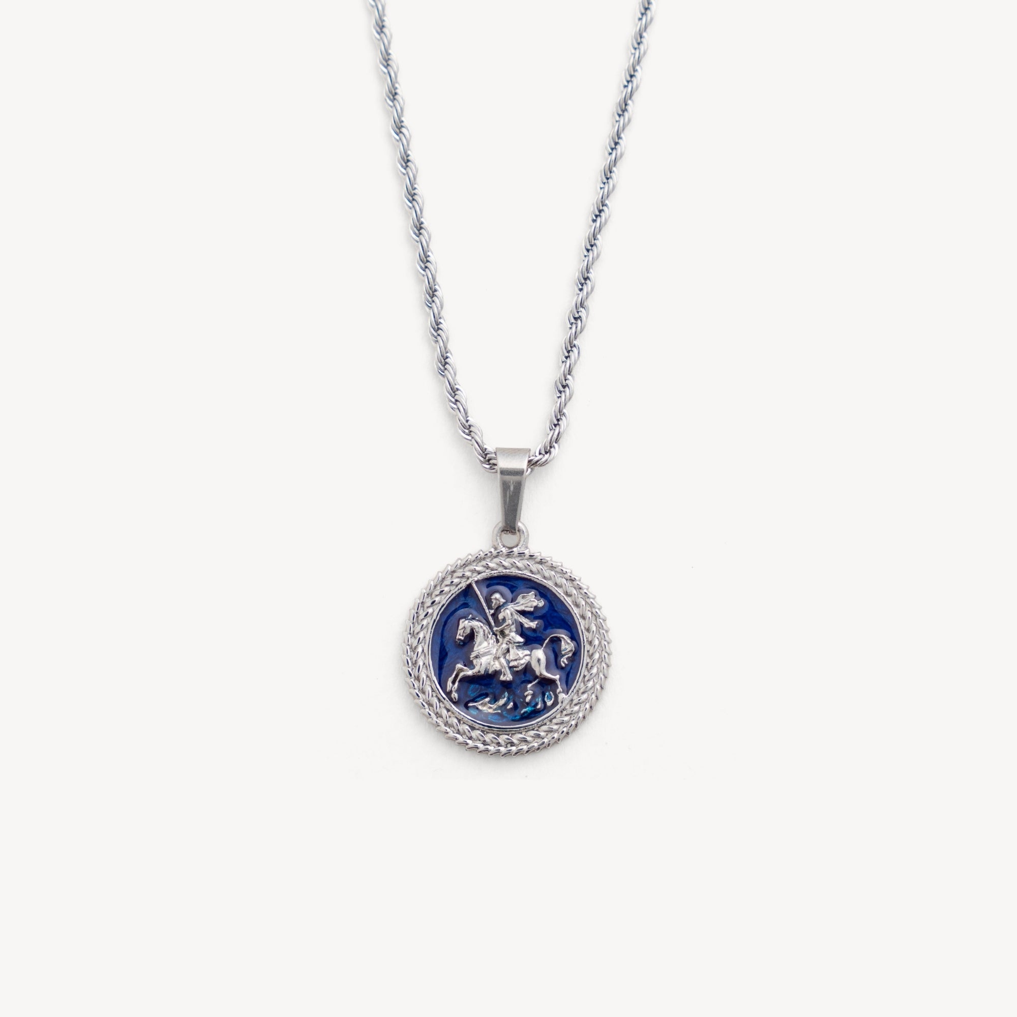 Silver necklace with a round pendant featuring a blue design on a white background