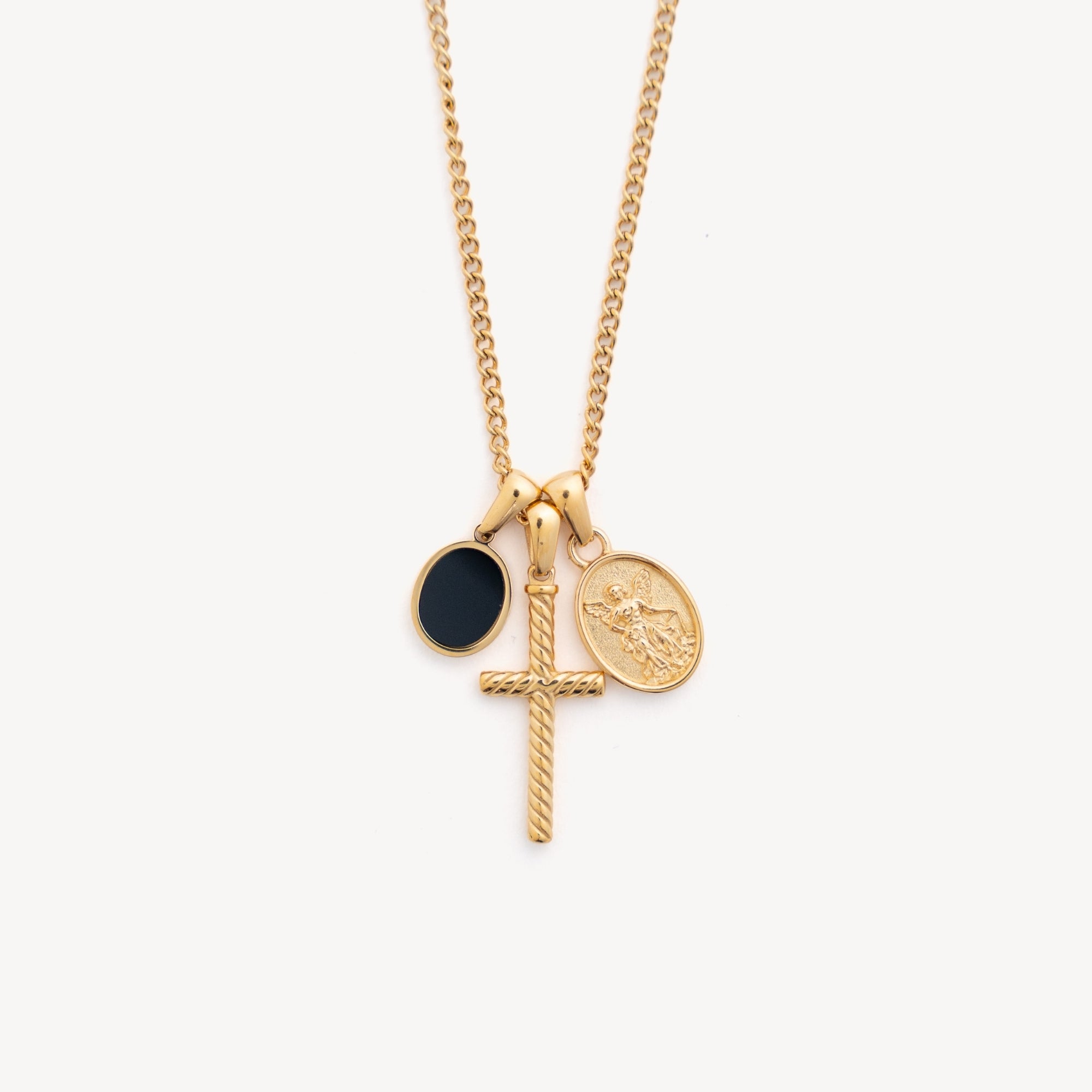 Gold necklace with a cross and circular pendants on a white background